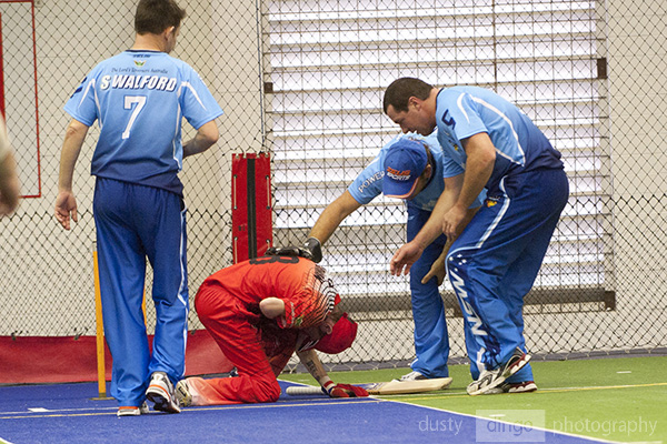 Opponents rush to the aid of an injured player