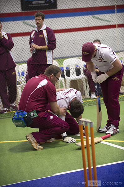 Injured player receiving first aid on court